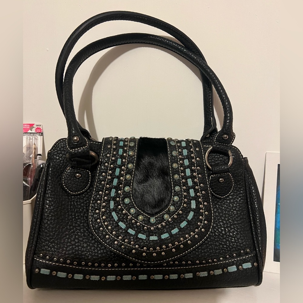 New purse, barely used, leather and has cow hide on it, with turquoise leather